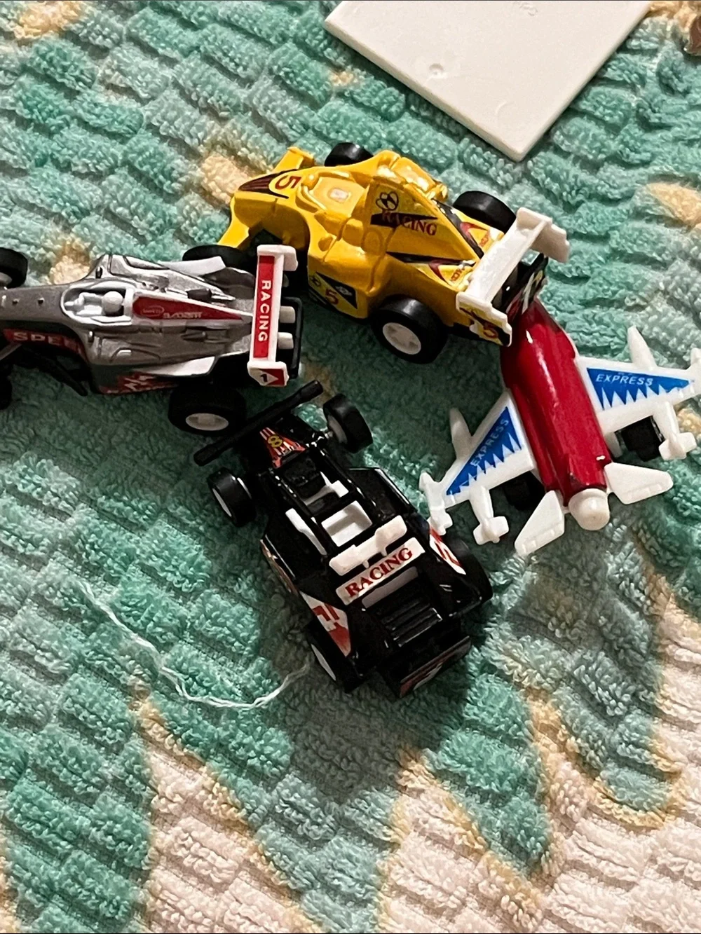 Vintage Red & White Toy Jet with Yellow and Black Race Cars